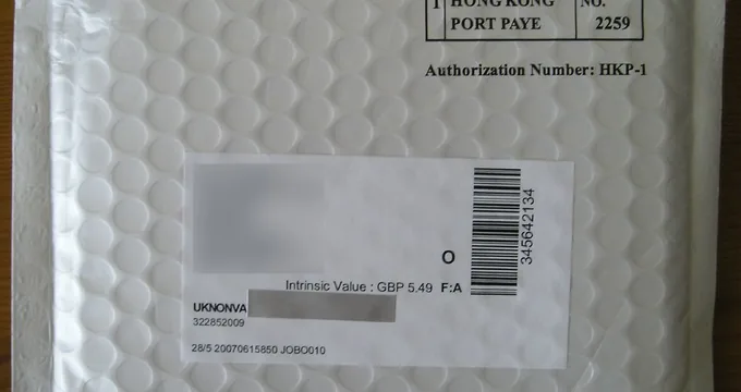 A sealed air mail envelope bearing postage and a printed authorisation number.